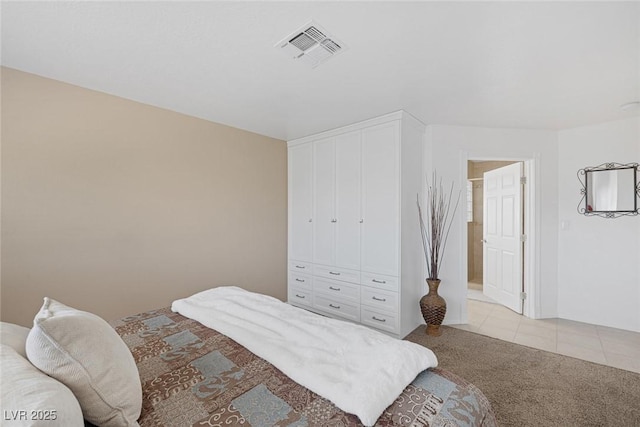 bedroom featuring light carpet