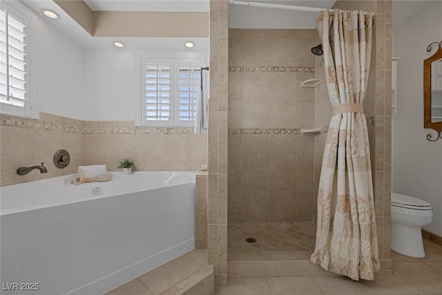 bathroom with independent shower and bath, tile patterned floors, and toilet