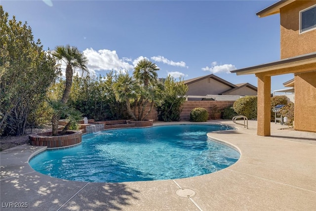 view of swimming pool featuring pool water feature and a patio