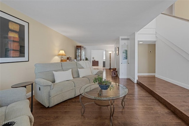 living room with dark hardwood / wood-style flooring