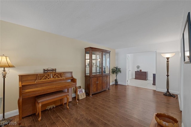 miscellaneous room featuring dark hardwood / wood-style flooring