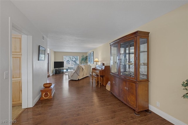 bedroom with dark hardwood / wood-style flooring