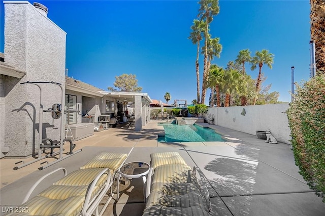 view of pool with a patio area, a fenced backyard, and a fenced in pool