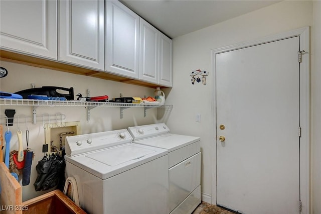 laundry area featuring cabinet space and washer and dryer