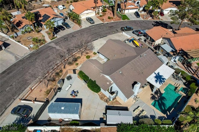 birds eye view of property with a residential view