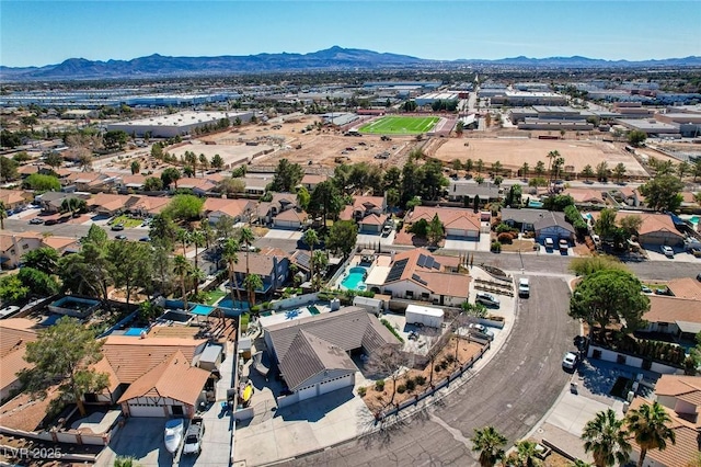 drone / aerial view with a residential view and a mountain view