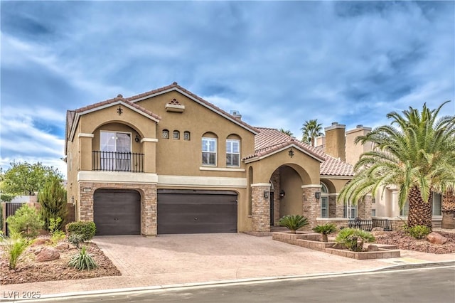 mediterranean / spanish-style house featuring a garage