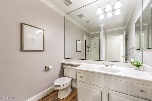 bathroom with hardwood / wood-style floors, ornamental molding, vanity, walk in shower, and toilet