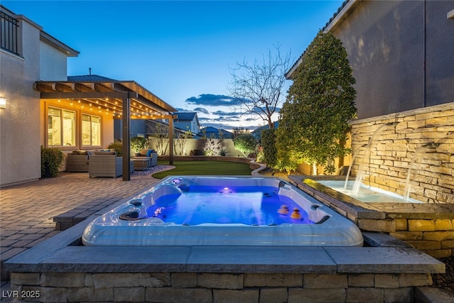 view of pool with a patio area, an outdoor hot tub, fence, and an outdoor hangout area