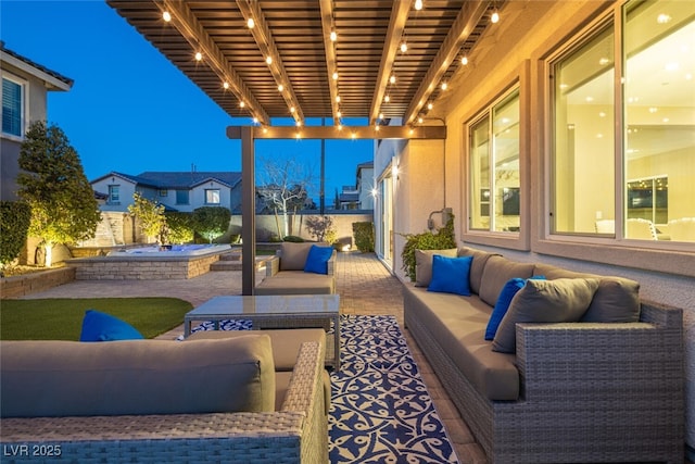 view of patio / terrace with an in ground hot tub, outdoor lounge area, and a fenced backyard