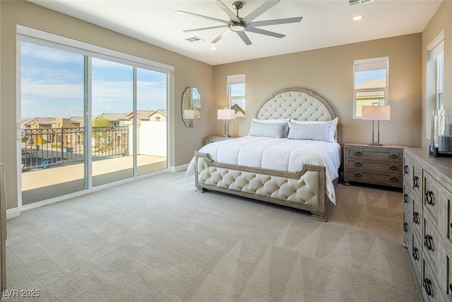 bedroom featuring light carpet, access to outside, and multiple windows