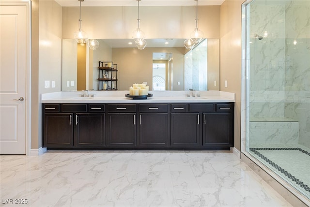 full bathroom featuring marble finish floor, a walk in shower, and a sink