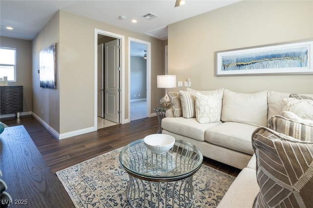 living room featuring recessed lighting, wood finished floors, visible vents, and baseboards