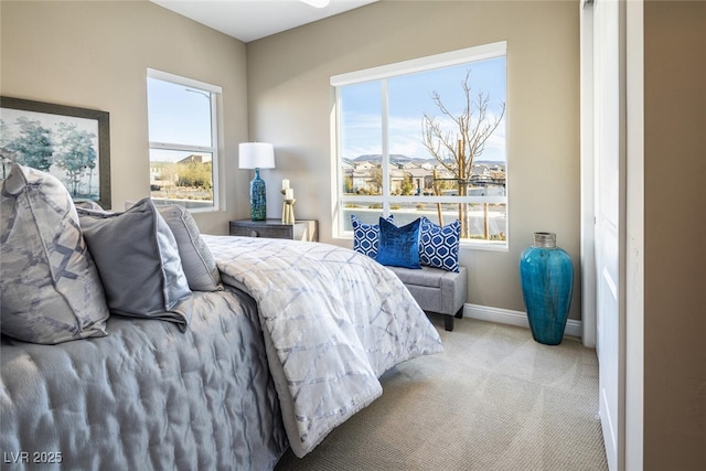 carpeted bedroom with baseboards