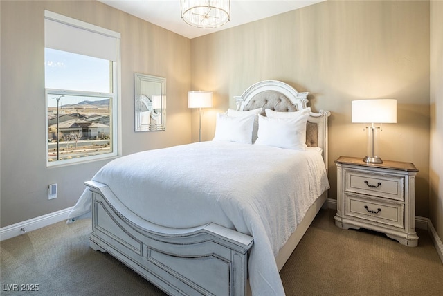 bedroom with carpet floors, a notable chandelier, and baseboards