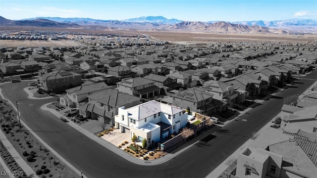 aerial view featuring a mountain view and a residential view