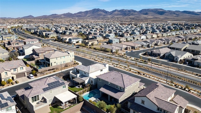 birds eye view of property with a residential view and a mountain view