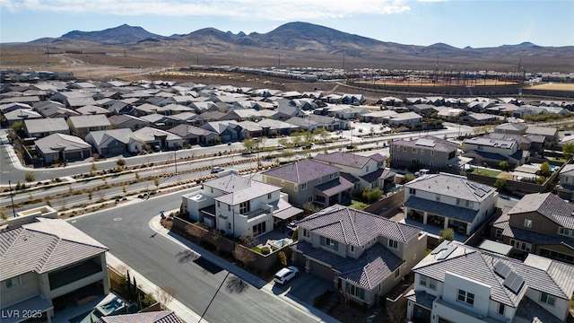 drone / aerial view featuring a residential view and a mountain view