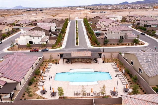 drone / aerial view featuring a residential view and a mountain view