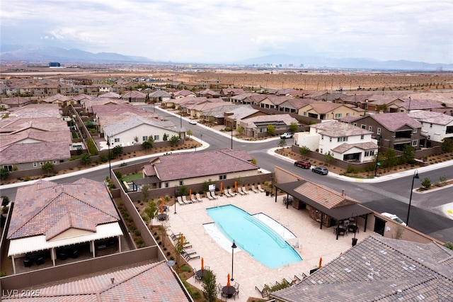 drone / aerial view featuring a mountain view and a residential view