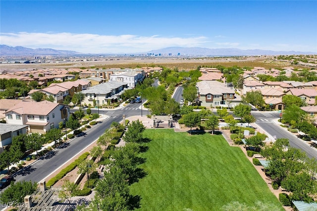 drone / aerial view featuring a residential view and a mountain view