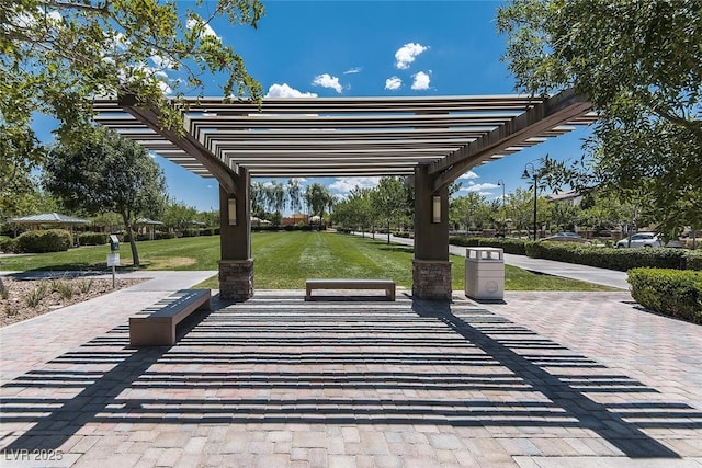 surrounding community with a lawn and a pergola