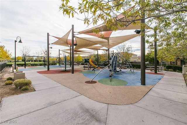 view of property's community featuring playground community