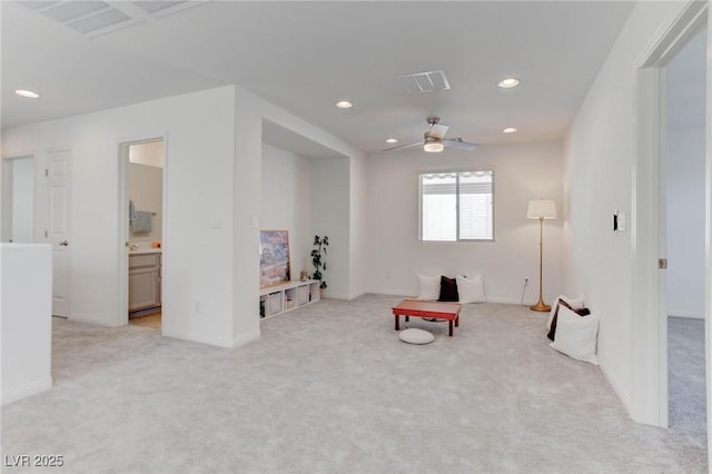 sitting room with light carpet and ceiling fan