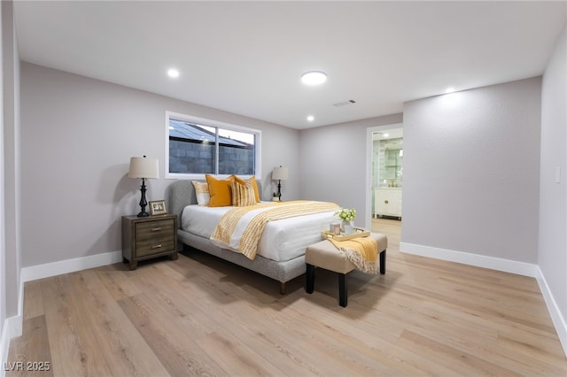 bedroom with light wood-style floors, recessed lighting, visible vents, and baseboards