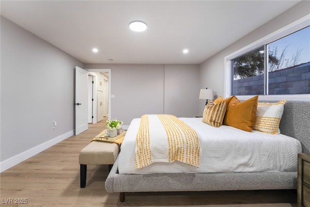 bedroom with recessed lighting, baseboards, and light wood finished floors