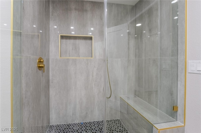 full bathroom with tiled shower