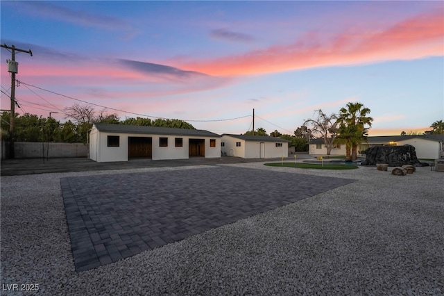 view of front of home featuring decorative driveway