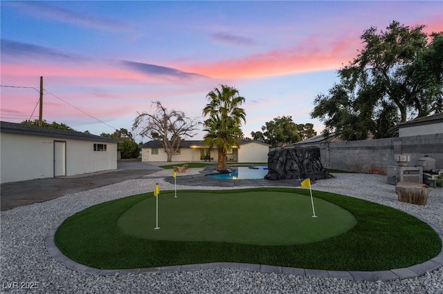 view of community with a patio area, a fenced backyard, and a pool