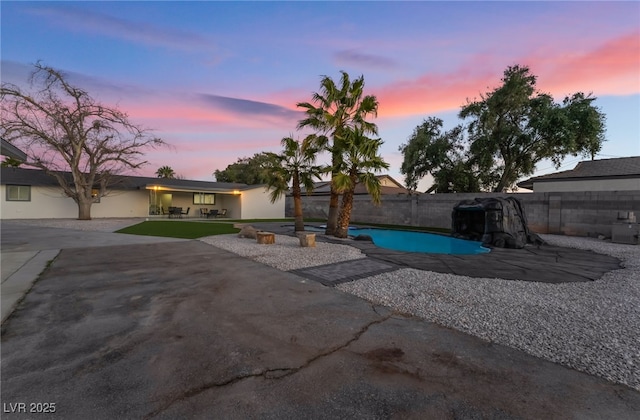 view of swimming pool featuring a patio area and a fenced backyard