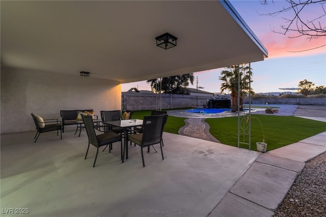 view of patio with outdoor dining space, an outdoor pool, and fence