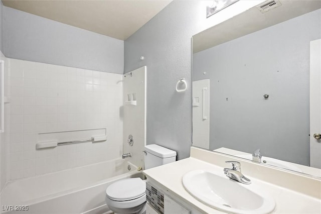 full bathroom with vanity, bathtub / shower combination, and toilet