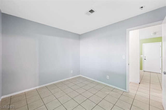 unfurnished room featuring light tile patterned flooring