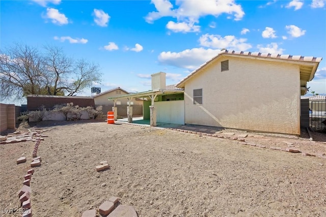 back of house featuring a patio