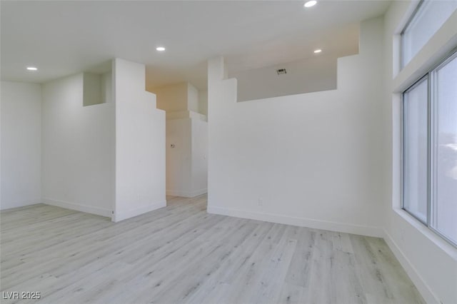 spare room featuring light hardwood / wood-style flooring