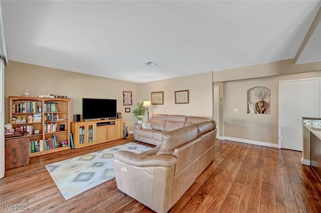 living room with light hardwood / wood-style floors