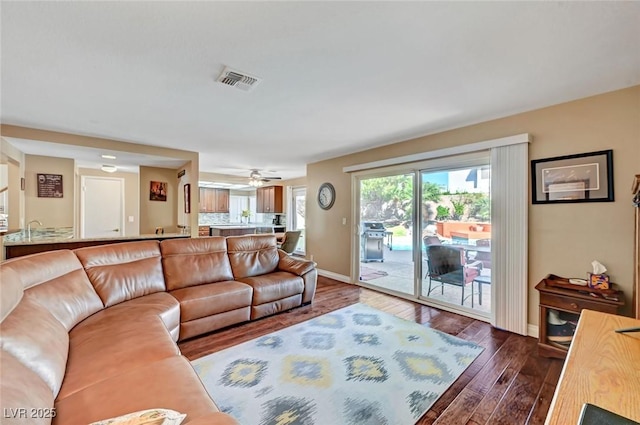 living room with dark hardwood / wood-style floors