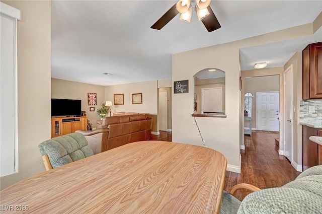 dining room featuring dark wood-type flooring and ceiling fan