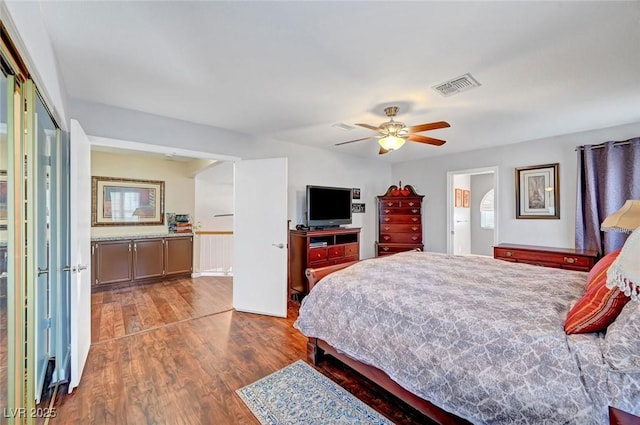 bedroom with dark wood-type flooring and ceiling fan