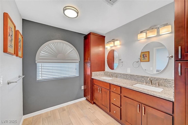 bathroom featuring vanity and hardwood / wood-style flooring