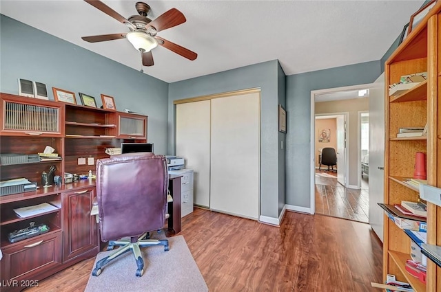 office space featuring hardwood / wood-style flooring and ceiling fan