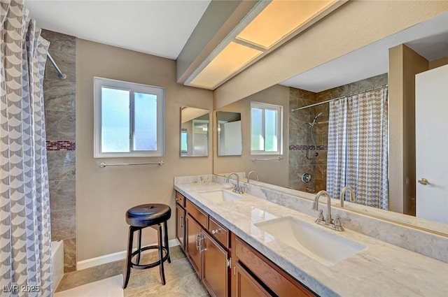 bathroom with plenty of natural light, curtained shower, and vanity