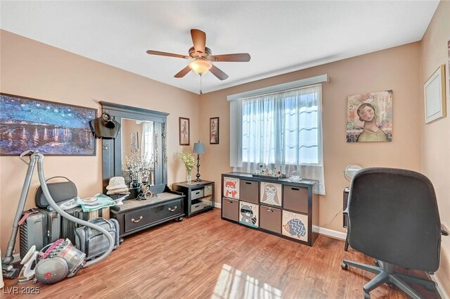 office space featuring ceiling fan and light hardwood / wood-style flooring