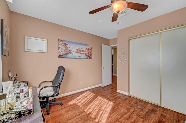 office featuring hardwood / wood-style flooring and ceiling fan