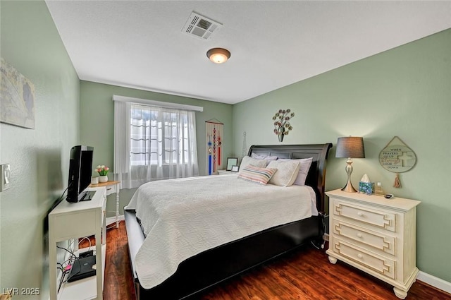 bedroom featuring dark wood-type flooring