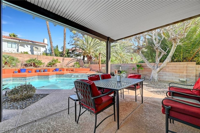 view of patio / terrace featuring a fenced in pool